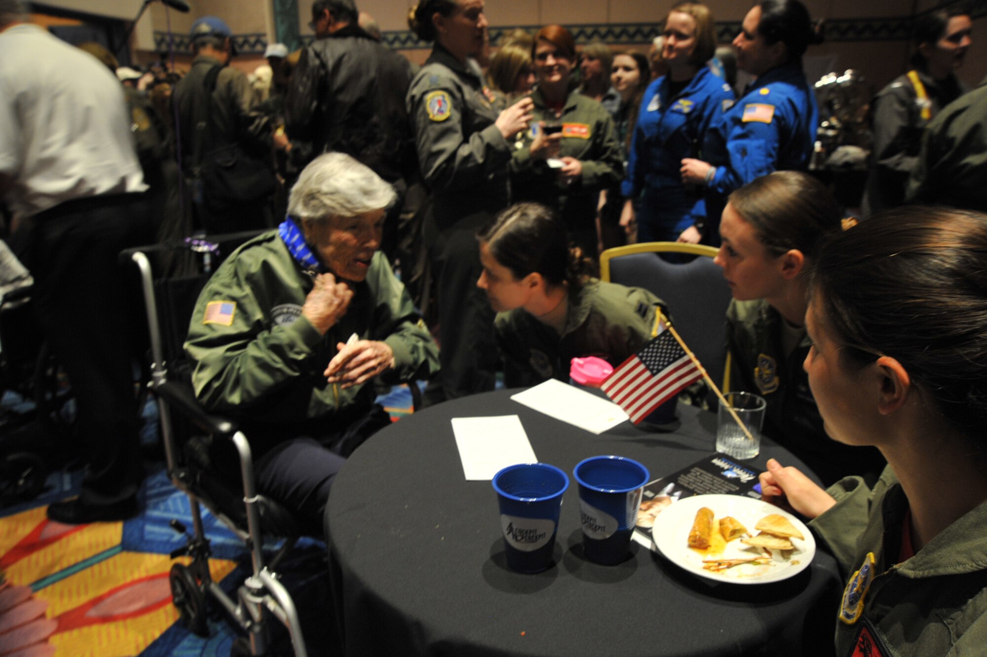 Capt. Rachel Quirarte, 349th Air Refueling Squadron KC-135 Stratotanker pilot, Staff Sgt. Danielle Warren, 344th ARS boom operator, and 1st Lt. Adria Trgovcich, 350th ARS navigator, sit with Dawn Seymour, a World War II Women Airforce Service Pilot, at the Women Military Aviators flight suit social during the Women in Aviation Conference March 3, 2017 in Orlando, Fla. Seymour celebrated her 100th birthday this year and shared personal stories to members of Team McConnell. (U.S. Air Force photo/2nd Lt. Carla Stefaniak)