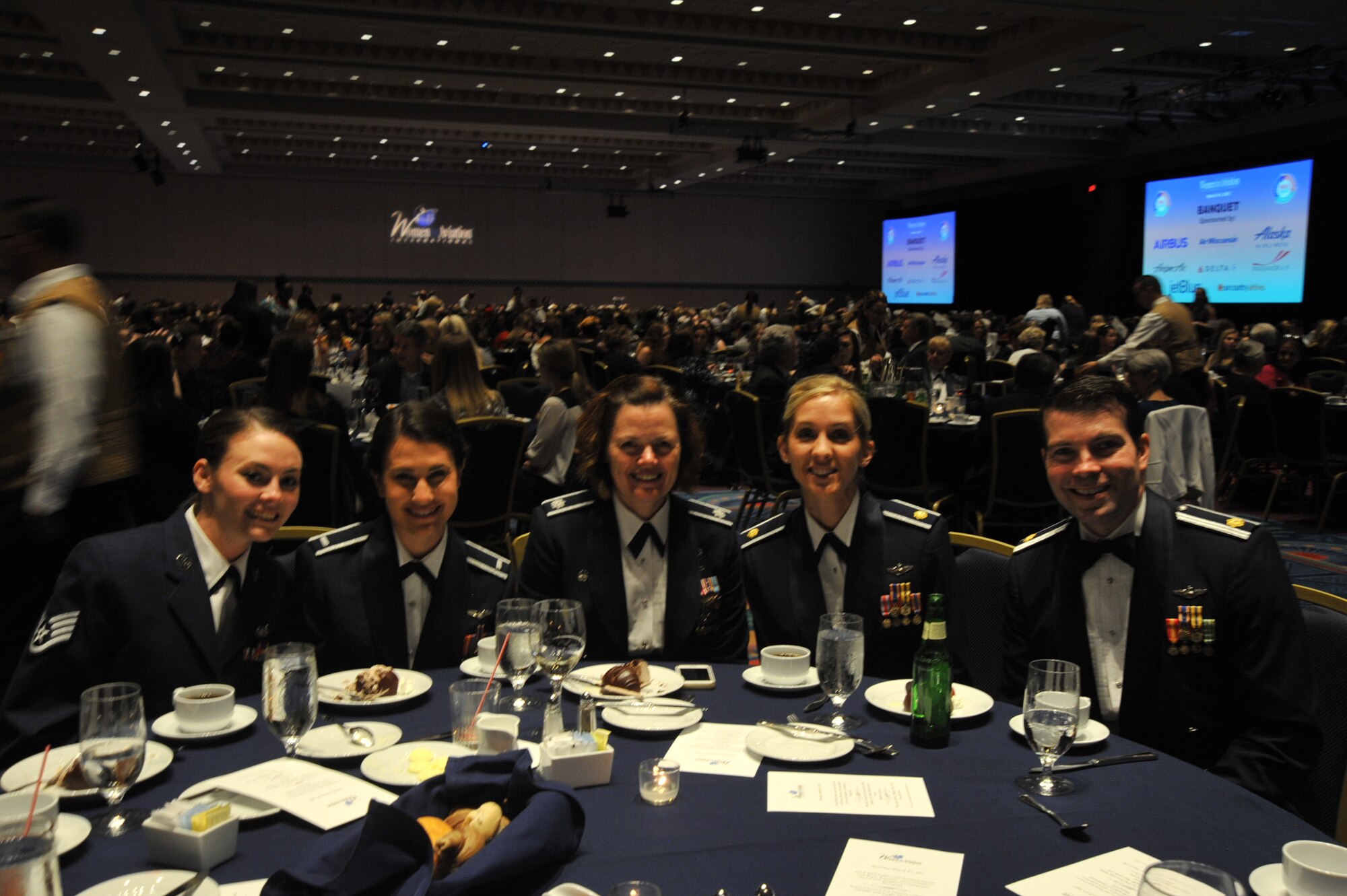 Members of Team McConnell enjoy the final banquet to honor Women in Aviation Pioneer inductees and scholarship recipients March 4, 2017 in Orlando, Fla. Over 120 different scholarships were distributed to further recipients’ careers in aviation, totaling $643,274. (U.S. Air Force photo/2nd Lt. Carla Stefaniak)