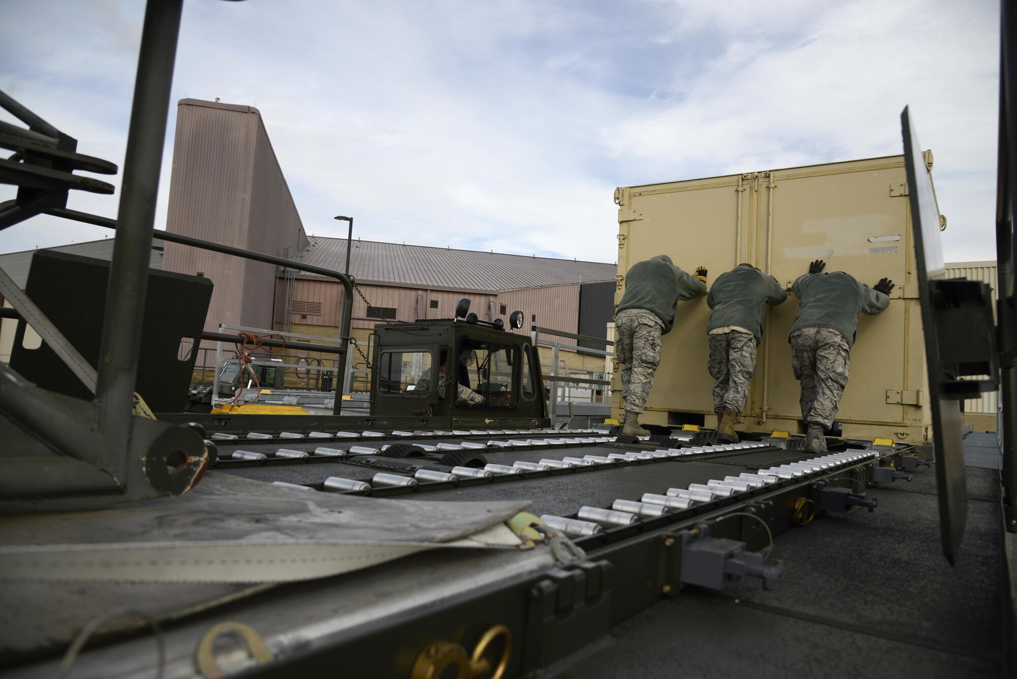 Air transportation specialists from the 105th Airlift Wing offload cargo during refresher training at Stewart Air National Guard Base, Newburgh, New York Feb. 8, 2017. The 105th Airlift Wing teaches initial and refresher training on the 60k loader for the entire Air National Guard. (U.S. Air Force photo by Staff Sgt. Julio A. Olivencia Jr.)