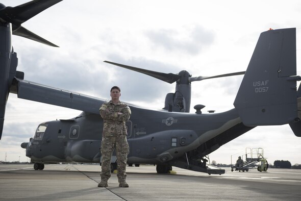 Staff Sgt. Justin O’Brien, 7th Special Operations Squadron special mission aviator, stands in front of a CV-22 Osprey Mar. 7, 2017, on RAF Mildenhall, England. The CV-22 is a tiltrotor aircraft that combines the vertical takeoff, hover and vertical landing qualities of a helicopter with the long-range, fuel efficiency and speed characteristics of a turboprop aircraft. (U.S. Air Force photo/Capt Chris Sullivan)
