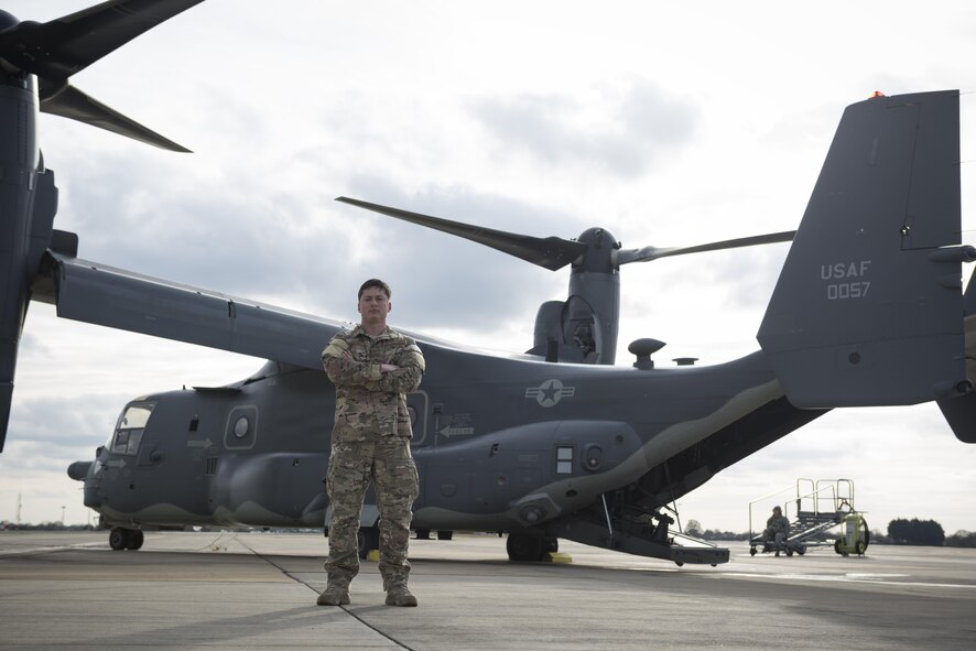 Staff Sgt. Justin O’Brien, 7th Special Operations Squadron special mission aviator, stands in front of a CV-22 Osprey Mar. 7, 2017, on RAF Mildenhall, England. The CV-22 is a tiltrotor aircraft that combines the vertical takeoff, hover and vertical landing qualities of a helicopter with the long-range, fuel efficiency and speed characteristics of a turboprop aircraft. (U.S. Air Force photo/Capt Chris Sullivan)
