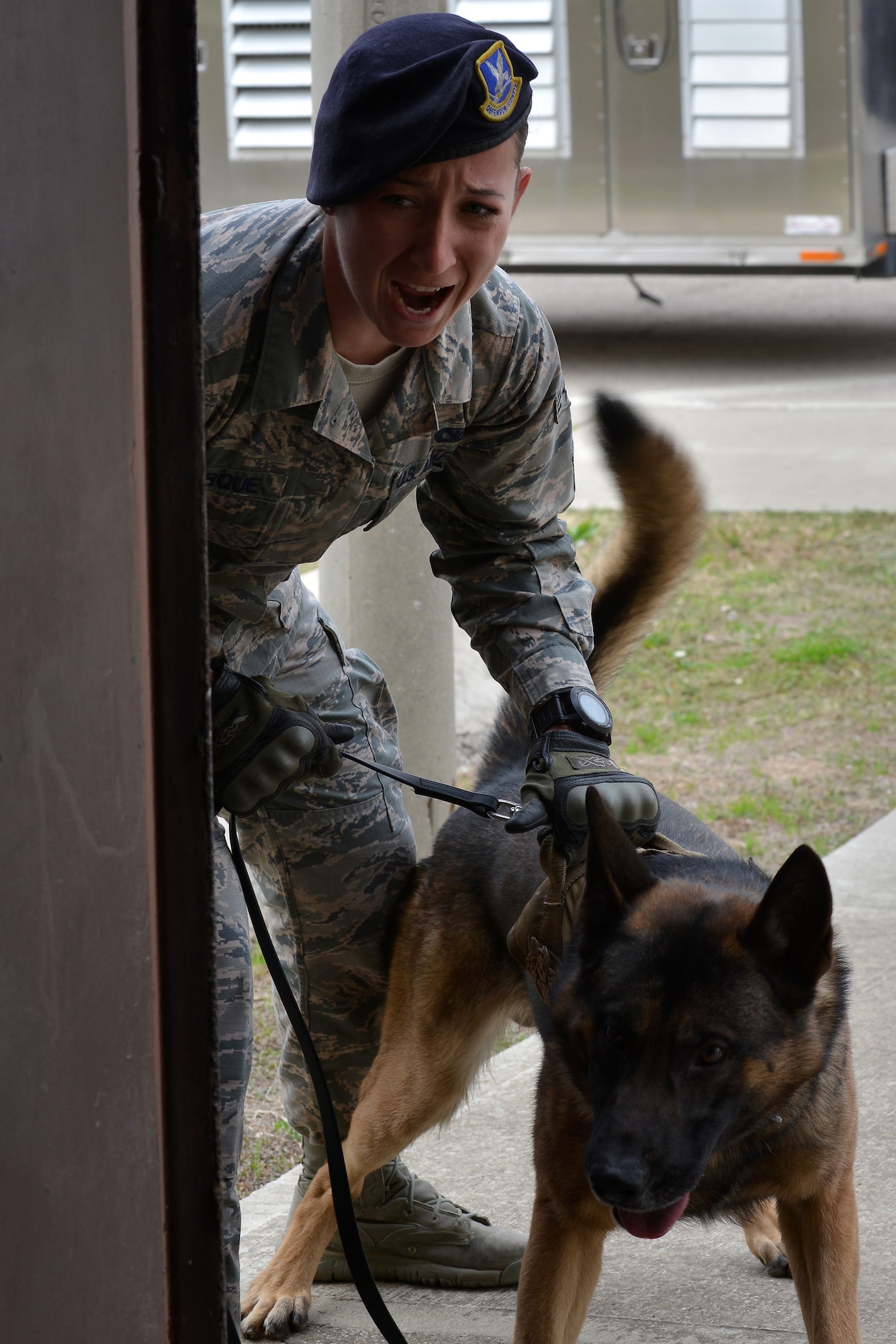 U.S. Air Force Senior Airman Caitlin Bourque, 39th Security Forces Squadron military working dog handler, and Brix, relay a warning prior to entering a building during detection training, Mar. 2, 2017, at Incirlik Air Base, Turkey. The warning offers perpetrators a chance to surrender before law enforcement engages with force. (U.S. Air Force photo by Senior Airman John Nieves Camacho)