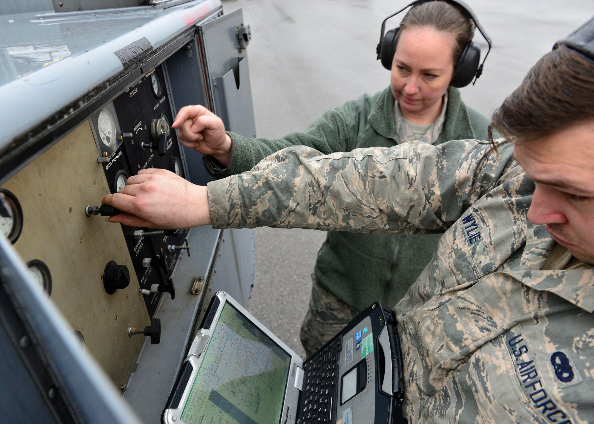Tech. Sgt. Sabrina Aviles, 372nd Training Squadron production superintendent and Aerospace Ground Equipment instructor, assists Airman 1st Class Nathan Wylie, 31st Maintenance Squadron AGE apprentice, with a systems check, Jan. 31, 2017, at Aviano Air Base, Italy. Aviles uses her 18 years of AGE maintenance experience to instruct Airmen about advanced maintenance techniques. (U.S. Air Force photo by Senior Airman Cary Smith)
