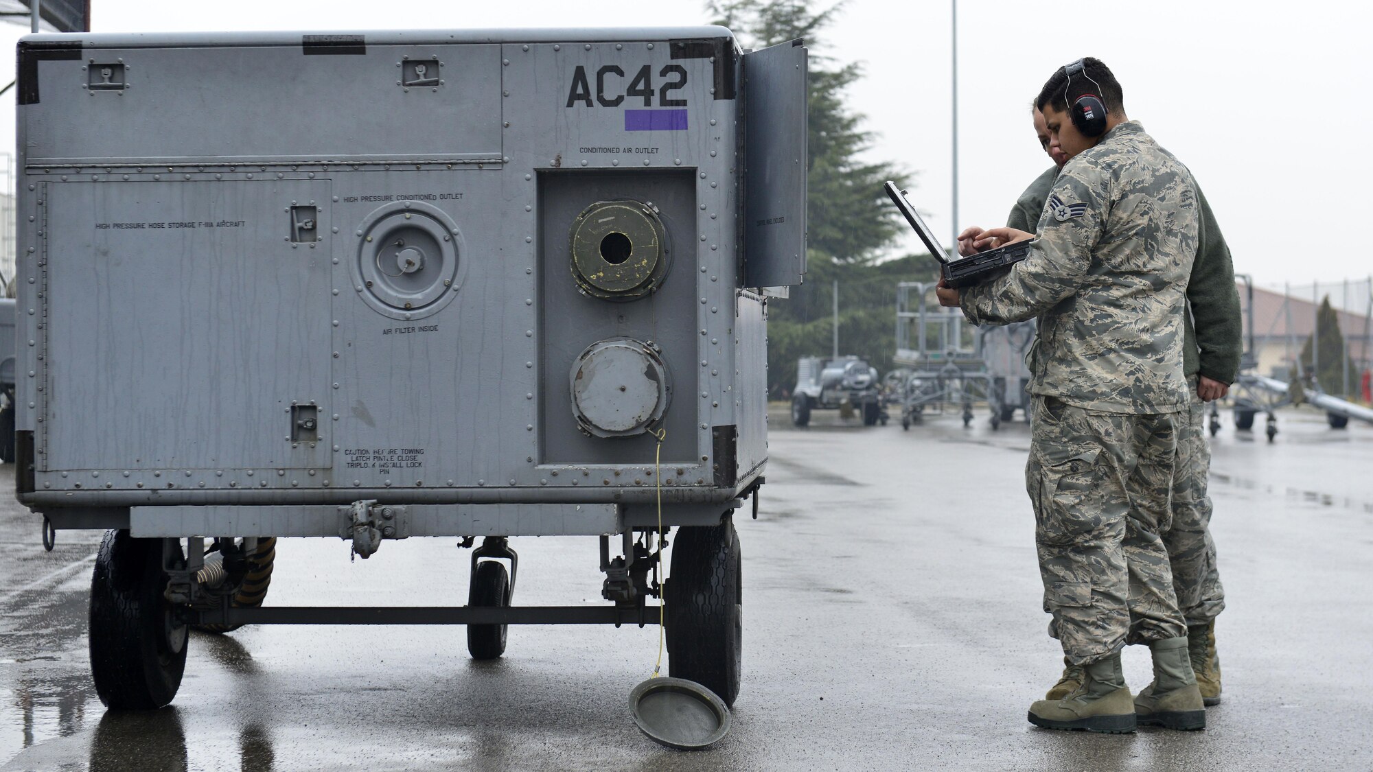 Senior Airman David Castillo-Collazo, 31st Maintenance Squadron Aerospace Ground Equipment journeyman, and Tech. Sgt. Sabrina Aviles, 372nd Training Squadron production superintendent and AGE instructor, troubleshoot a temperature regulator, Jan. 31, 2017, at Aviano Air Base, Italy. Detachment 24 instructors teach Airmen how to properly, safely and efficiently support combat operations by using essential maintenance practices. (U.S. Air Force photo by Senior Airman Cary Smith)