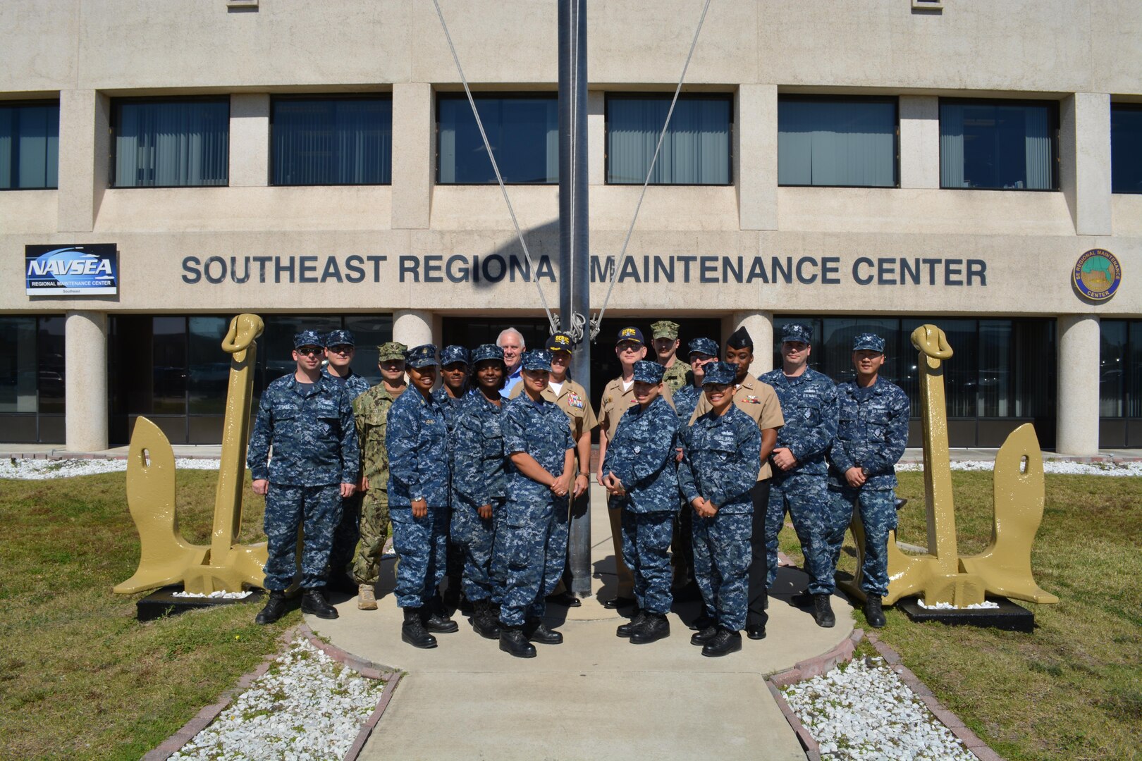Capt. Dave Gombas, Commanding Officer (back row, center right); Capt. Gary Martin (back row, center left), Executive Officer and Bob Wright (back row, center left), Executive Director at Southeast Regional Maintenance Center (SERMC) are surrounded by Navy Counselor Chief Shanika Jones (4th from left) and a few of the SERMC Sailors who reenlisted during Fiscal Year 2016. SERMC was recognized for successful Sailor programs that form the foundation of a successful retention effort, earning the coveted “Golden Anchors” award.