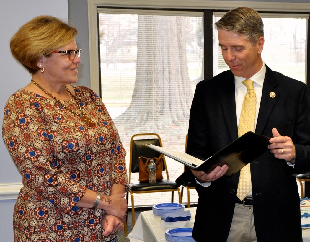 DAHLGREN, Va. (March 3, 2017) - Rep. Rob Wittman (R-VA) reads his letter of appreciation to Christine Mason at her retirement ceremony. The congressman thanked Christine for her 37 years of government service in addition to her community service, including non-profit events and groups she established or co-founded such as the 'Frazier-Mason Some Gave All Foundation'. The non-profit organization was founded in 2007 in memory of Christine's son, Army Sgt. Nicholas Mason of King George, and Marine Sgt. Joshua Frazier of Spotsylvania.  Both men were killed in the line of duty in Iraq. The foundation honors these men and all others who have been wounded or killed in service to their country. The Some Gave All Foundation accepts applications from Virginia residents for grant money to provide assistance to wounded veterans from the area. Funds are available to meet the needs of veterans who require financial support as a direct result of their injuries sustained during the Iraqi and Afghanistan Conflicts. Individuals may apply by downloading an application under "Application and Information" via http://www.somegaveall.org.