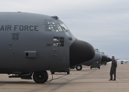 Staff Sgt. Michael J. Davis, a loadmaster with the 136th Mission Support Group, Texas Air National Guard, completes a pre flight inspection on a C-130H2 Hercules aircraft, Feb. 26, 201, at Naval Air Station Fort Worth Joint Reserve Base, Texas. Davis, along with other traditional Guardsmen, flew a max-fly effort that utilized only traditional Airmen. 