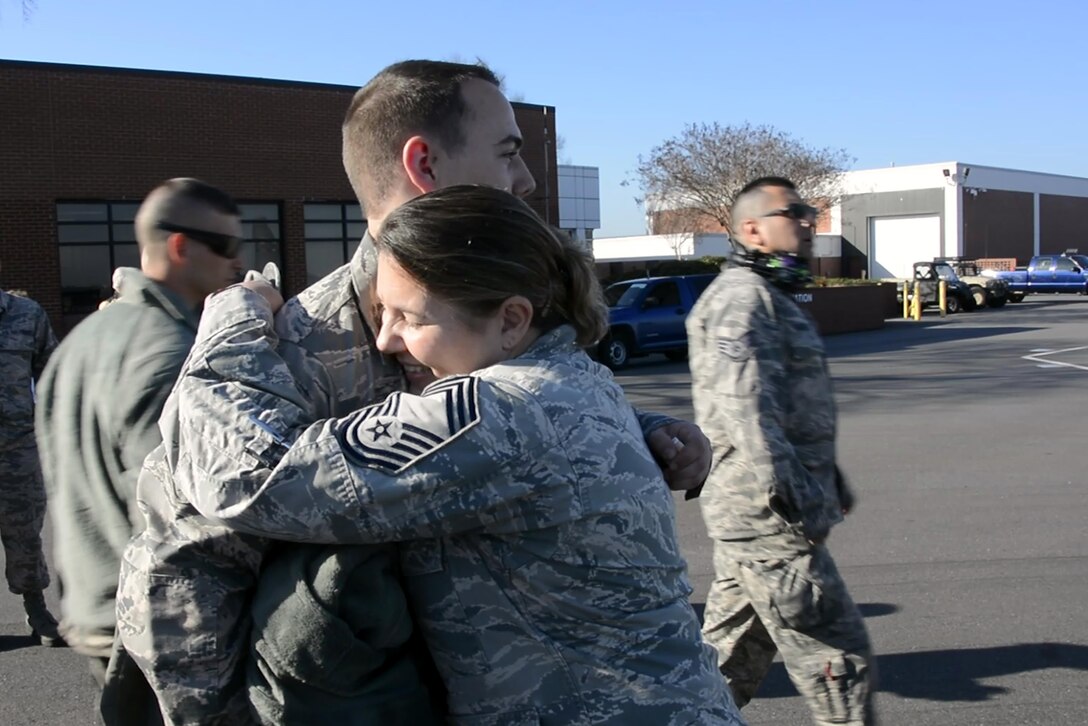 U.S. Air Force Chief Master Sgt. Susan Dietz (right), 145th Medical Group, hugs her son, Senior Airman Jonathan Dietz (left), 145th Aircraft Maintenance Squadron, on the flightline before he boards a C-130 Hercules aircraft at the North Carolina Air National Guard Base, Charlotte Douglas International Airport, Feb. 23, 2017. Airmen of the 145th Airlift Wing are deploying in support of Operation Freedom’s Sentinel to provide tactical airlift in the region.