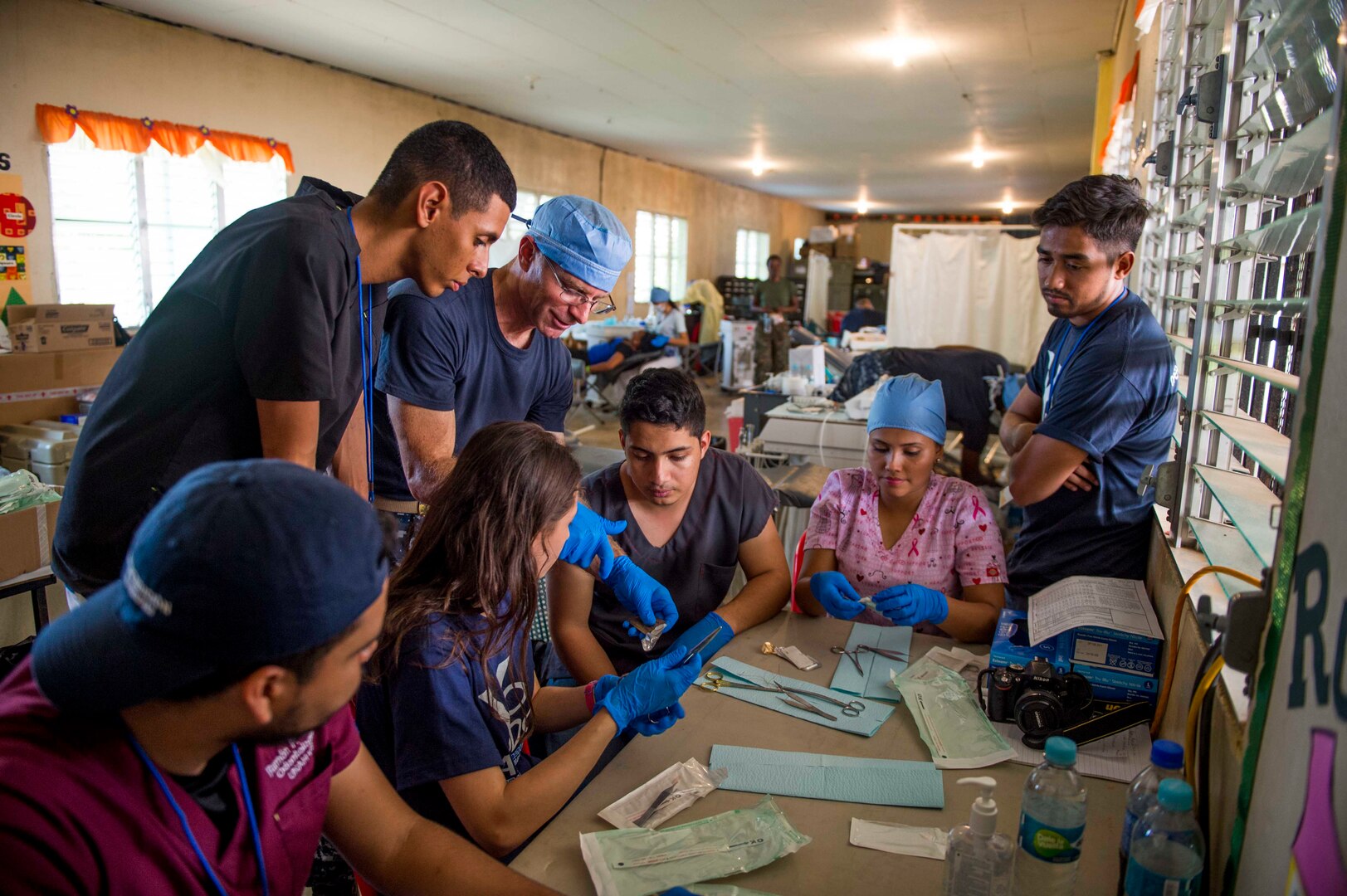 TRUJILLO, Honduras (Feb. 25, 2017) Cmdr. Christopher Crecelius, assigned to Walter Reed National Military Medical Center, Bethesda, Md., conducts a dental procedure training session for Honduran residents during Continuing Promise 2017 (CP-17) in Trujillo, Honduras. CP-17 is a U.S. Southern Command-sponsored and U.S. Naval Forces Southern Command/U.S. 4th Fleet-conducted deployment to conduct civil-military operations including humanitarian assistance, training engagements, and medical, dental, and veterinary support to Central and South America. (U.S. Navy photo by Mass Communication Specialist 2nd Class Shamira Purifoy/Released)
