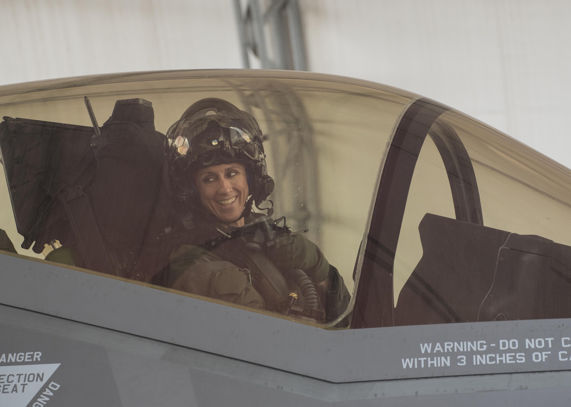 U.S. Air Force Lt. Col. Christine Mau, 33rd Operations Group deputy commander, looks back to one of her crew chiefs from an F-35A Lightning II Feb. 27, 2017, at Eglin Air Force Base, Florida. In 2013, Mau became the first and only female F-35 pilot in the world after flying the F-15E Strike Eagle for 16 years. She uses her unique position to embolden and motivate young men and women into the field of aviation. (U.S. Air Force photo by Staff Sgt. Peter Thompson)
