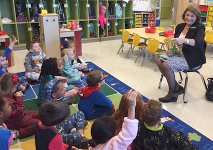 Dr. Gail Siller, Superintendent of Fort Sam Houston Independent School District, reads to Tasha Taylor's kindergarten class March 3 in celebration of Read Across America week honoring the birthday of Dr. Seuss. 