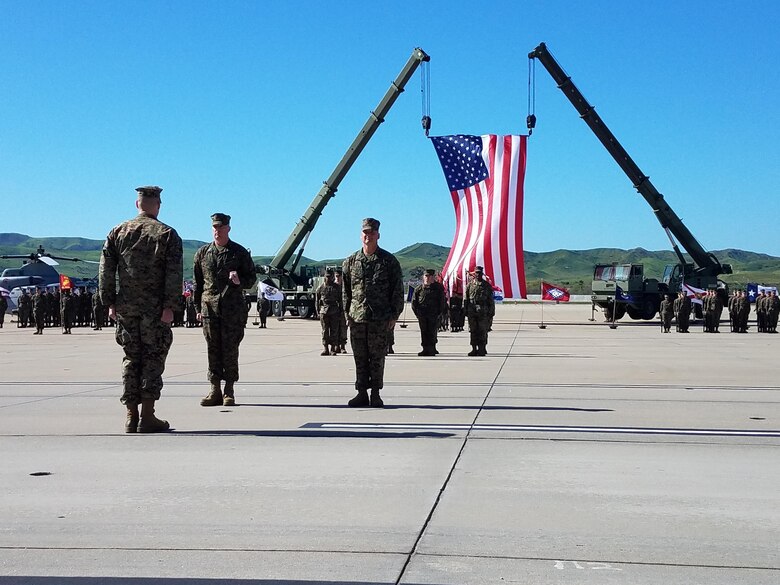 Sgt. Maj. Michael Pritchard, left, the outgoing sergeant major of Marine Aircraft Group (MAG) 39, prepares to pass the noncommissioned officer sword, to Sgt. Maj. Chad Butts, the incoming sergeant major of MAG-39, during a relief and appointment ceremony at Marine Corps Air Station Camp Pendleton, Calif., March 6. Pritchard was the driving force behind starting the MAG-39 corporal’s course during his time with the group. (U.S. Marine Corps photo by Lance Cpl. Liah Kitchen/Released)