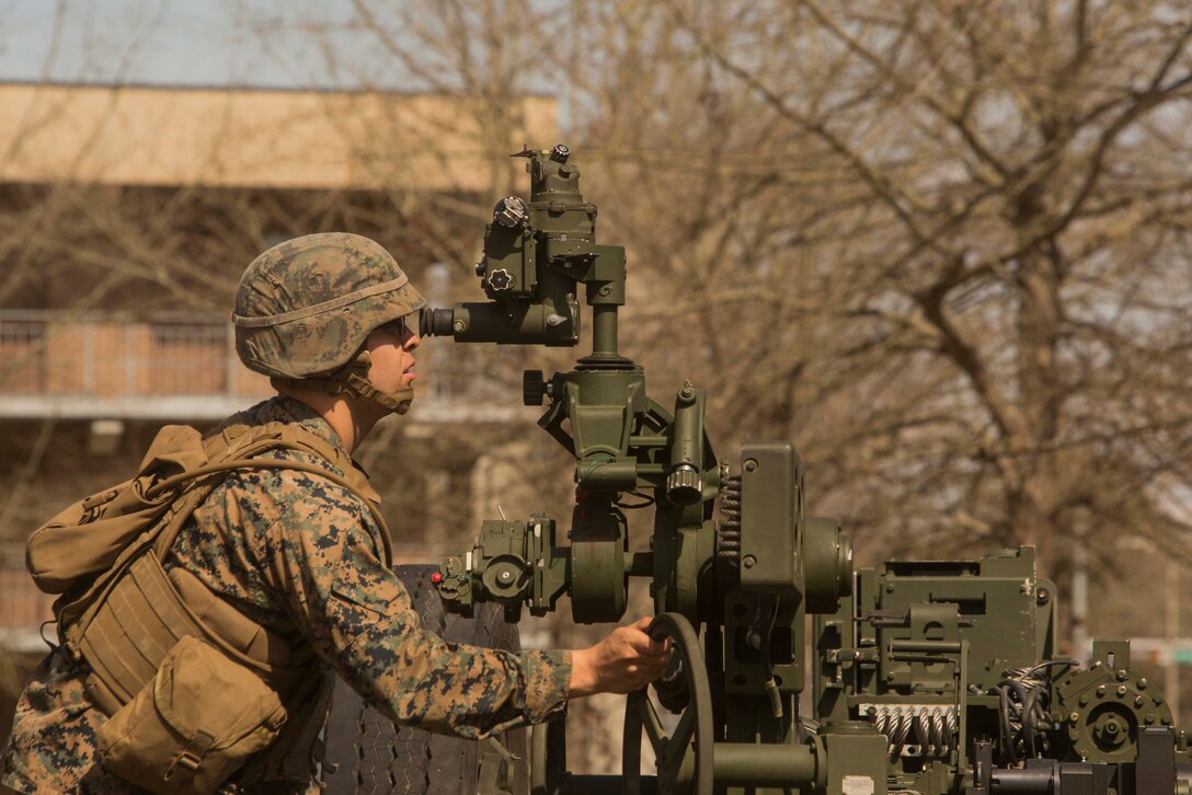 A Marine adjusts the main sight on a M777 howitzer during a gunner and assistant gunner course at Camp Lejeune, N.C., Mar. 7, 2017. The course is designed to help artillery Marines improve their proficiency in operating the M777 howitzer and 120mm expeditionary fire support system. The students participating in the course are from 1st Battalion and 2nd Battalion, 10th Marine Regiment, 2nd Marine Divisiont. (U.S. Marine Corps photo by Pfc. Abrey Liggins)