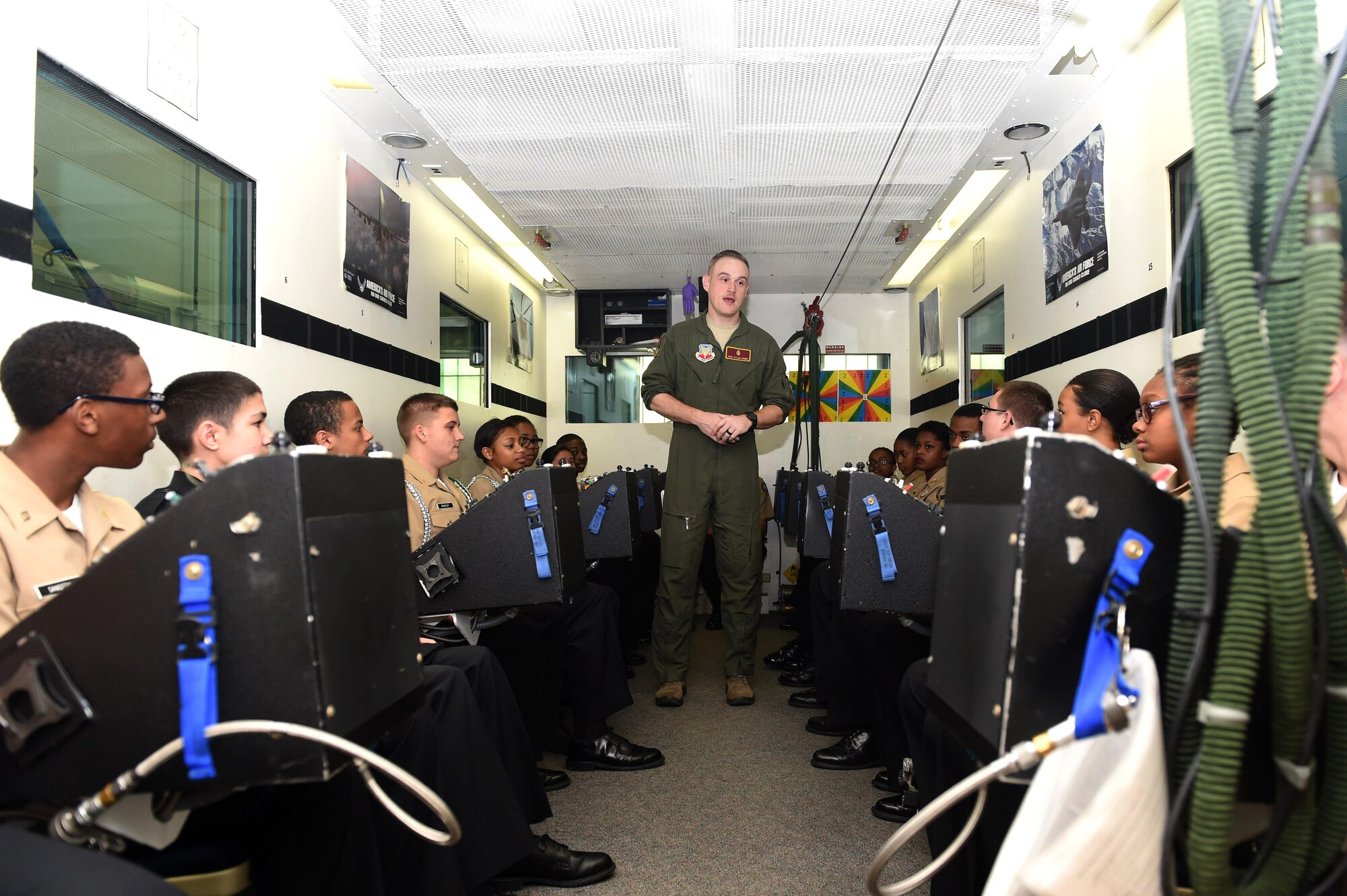 U.S. Air Force Staff Sgt. Dylan Crump, 633rd Aerospace Medicine Squadron aerospace and operational physiology technician, briefs Kecoughtan High School Navy JROTC students about the effects of oxygen deprivation on pilots at Joint Base Langley-Eustis, Va., Feb. 28, 2017. The students also toured the 633rd Security Forces Squadron, including the Military Working Dogs and armory, during their visit to the installation. (U.S. Air Force photo/Airman 1st Class Derek Seifert)