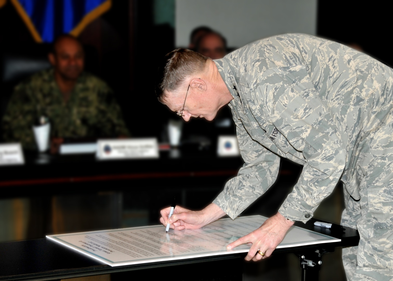 DLA Director Air Force Lt. Gen. Andy Busch signs the 2017 Sexual Assault Awareness and Prevention Month proclamation.