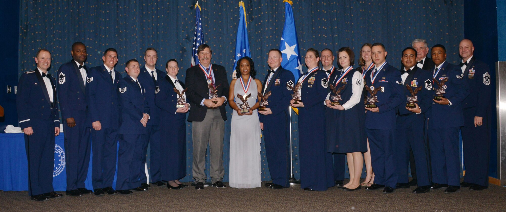 Recipients of the 377th Air Base Wing’s annual awards pose with wing leaders at the ceremony earlier this month at Kirtland Air Force Base.