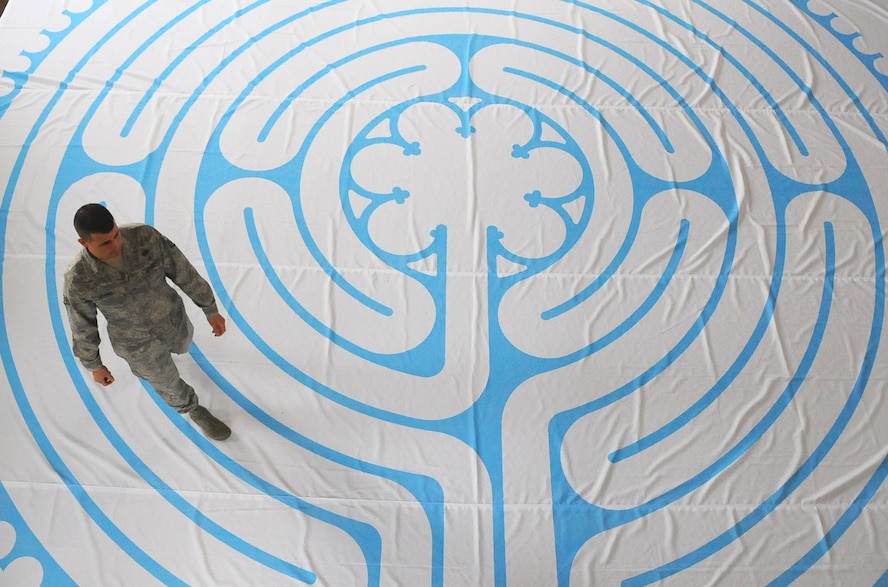 Staff Sgt. Derrick Lehner, 9th Reconnaissance Wing chaplain assistant and noncommissioned officer in charge of Airman community development walks the labyrinth at the Valley Chapel, March 7, 2017, at Beale Air Force Base, California. The labyrinth is a spiritual tool which can be traced back nearly 4,000 years. (U.S. Air Force photo/Airman 1st Class Aubrey Barringer)