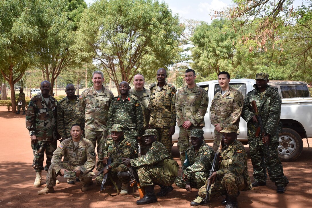 U.S. and Ugandan soldiers pause for a photo in Singo, Uganda, during the initial planning event for the African Readiness Training 2017 exercise, Feb. 15, 2017. Africa Readiness Training 2017 is a bilateral exercise between Ugandan and U.S. forces scheduled to take place in July in Uganda. Army photo