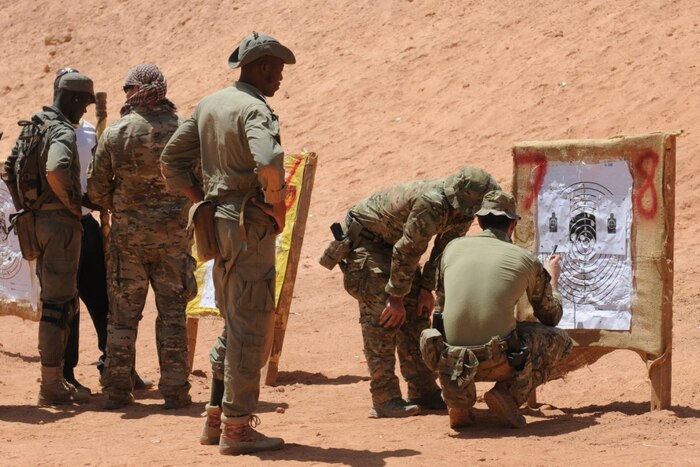 U.S. Special Forces soldiers assess the shot group of a Burkina Faso soldier during exercise Flintlock 2017, Camp Zagre, Burkina Faso, March 5, 2017. Army photo by Spc. Britany Slessman 