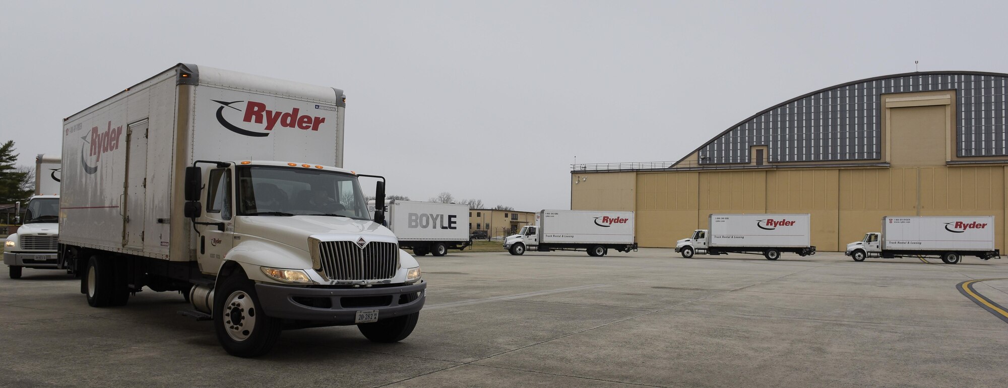 Trucks containing materials from President Obama's administration pull up outside of a hangar on Joint Base Andrews, Md. Feb. 14, 2017. Standing by to receive the materials were Joint Records Team (JRT) members made up of Airmen assigned to the Air Force District of Washington (AFDW) and Soldiers from the U.S. Army's 3rd Infantry Division "The Old Guard" worked in concert with Presidential Material Handlers from the National Archives and Records Management (NARA) over several months to ensure the safe movement of the records and artifacts gathered during the eight years of President Obama's administration. The JRT was tasked with helping to inventory, prepare for shipping, palletize and load several tons of paper records, terabytes of electronic records, and thousands of artifacts. Along with several truck shipments the bulk of the materials were loaded onto and Air Force C-5 Galaxy cargo aircraft brought in from Dover Air Force Base, Del., and were then flown to Chicago, Ill., where they were placed in secure storage until completion of Obama's Presidential Library. The library is part of the presidential library system, which is administered by the National Archives and Records Administration. (U.S. Air Force photo/Jim Varhegyi) (released)