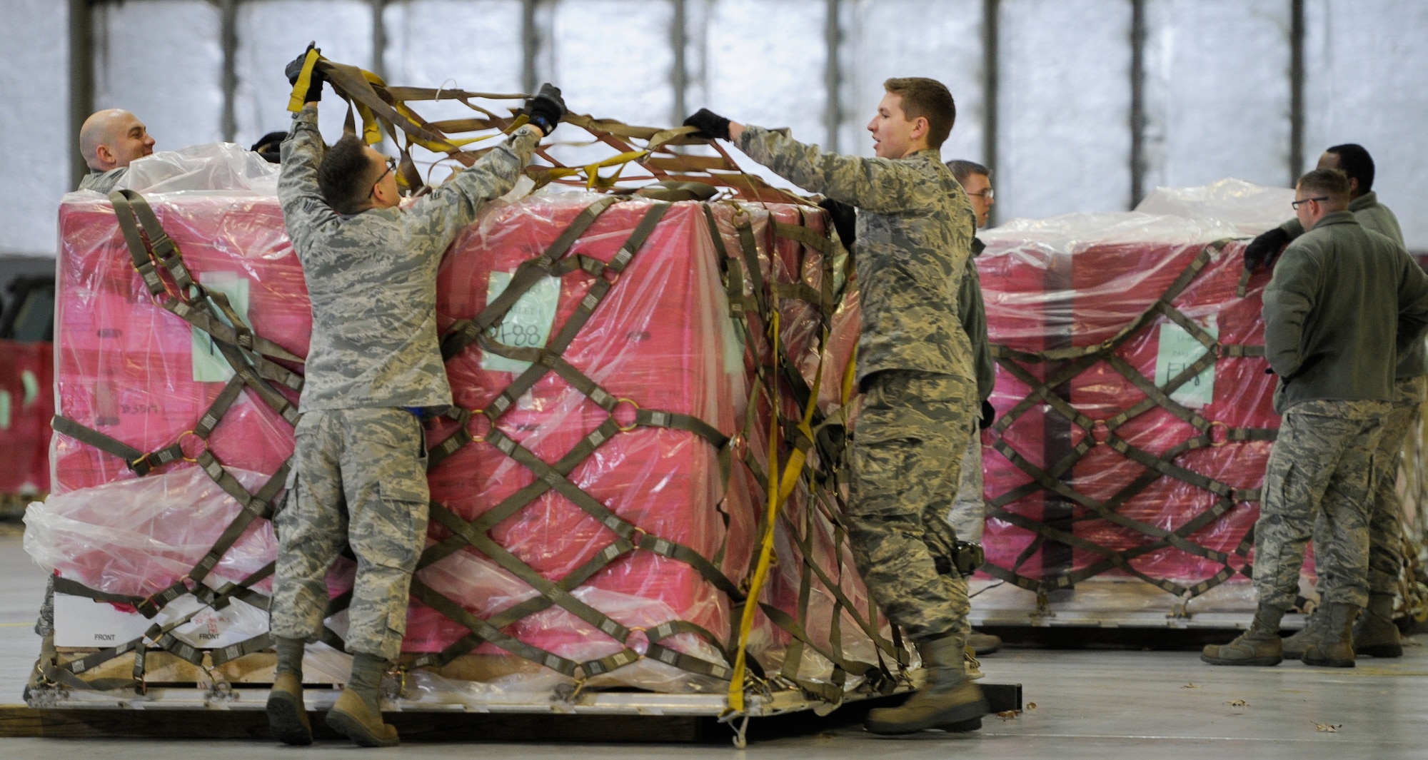 The Joint Records Team (JRT) made up of Airmen assigned to the Air Force District of Washington (AFDW) and Soldiers from the U.S. Army's 3rd Infantry Division "The Old Guard" worked in concert with Presidential Material Handlers from the National Archives and Records Management (NARA) over several months to ensure the safe movement of the records and artifacts gathered during the eight years of President Obama's administration. The JRT was tasked with helping to inventory, prepare for shipping, palletize and load several tons of paper records, terabytes of electronic records, and thousands of artifacts. Along with several truck shipments the bulk of the materials were loaded onto and Air Force C-5 Galaxy cargo aircraft brought in from Dover Air Force Base, Del., and were then flown to Chicago, Ill., where they were placed in secure storage until completion of Obama's Presidential Library. The library is part of the presidential library system, which is administered by the National Archives and Records Administration. (U.S. Air Force photo/Jim Varhegyi) (released)