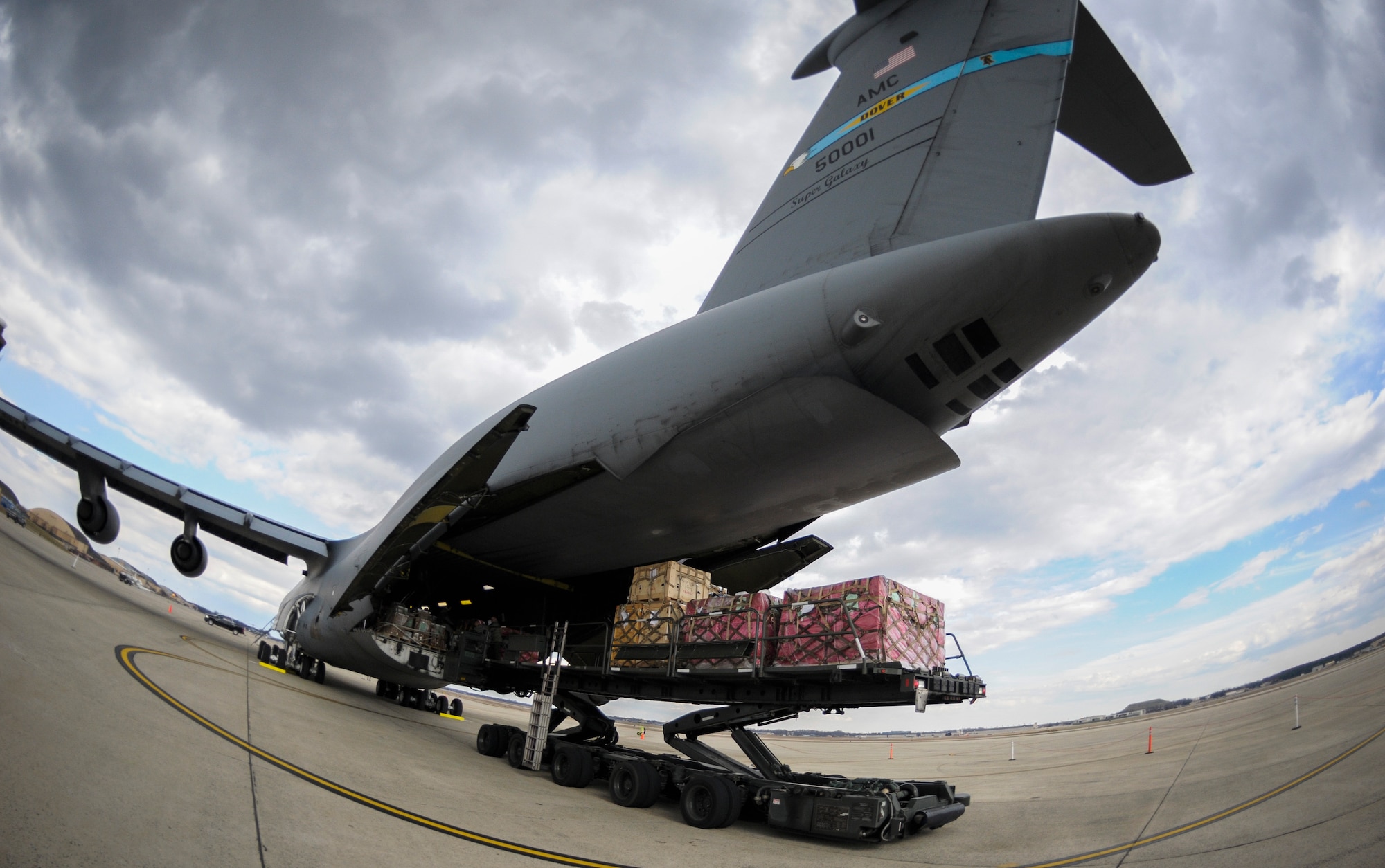 Presidential materials are loaded onto a C-5 Galaxy cargo aircraft at Joint Base Andrews, Md., Feb. 15, 2017. The Joint Records Team (JRT) made up of Airmen assigned to the Air Force District of Washington (AFDW) and Soldiers from the U.S. Army's 3rd Infantry Division "The Old Guard" worked in concert with Presidential Material Handlers from the National Archives and Records Management (NARA) over several months to ensure the safe movement of the records and artifacts gathered during the eight years of President Obama's administration. The JRT was tasked with helping to inventory, prepare for shipping, palletize and load several tons of paper records, terabytes of electronic records, and thousands of artifacts. Along with several truck shipments the bulk of the materials were loaded onto and Air Force C-5 Galaxy cargo aircraft brought in from Dover Air Force Base, Del., and were then flown to Chicago, Ill., where they were placed in secure storage until completion of Obama's Presidential Library. The library is part of the presidential library system, which is administered by the National Archives and Records Administration. (U.S. Air Force photo/Jim Varhegyi) (released) 