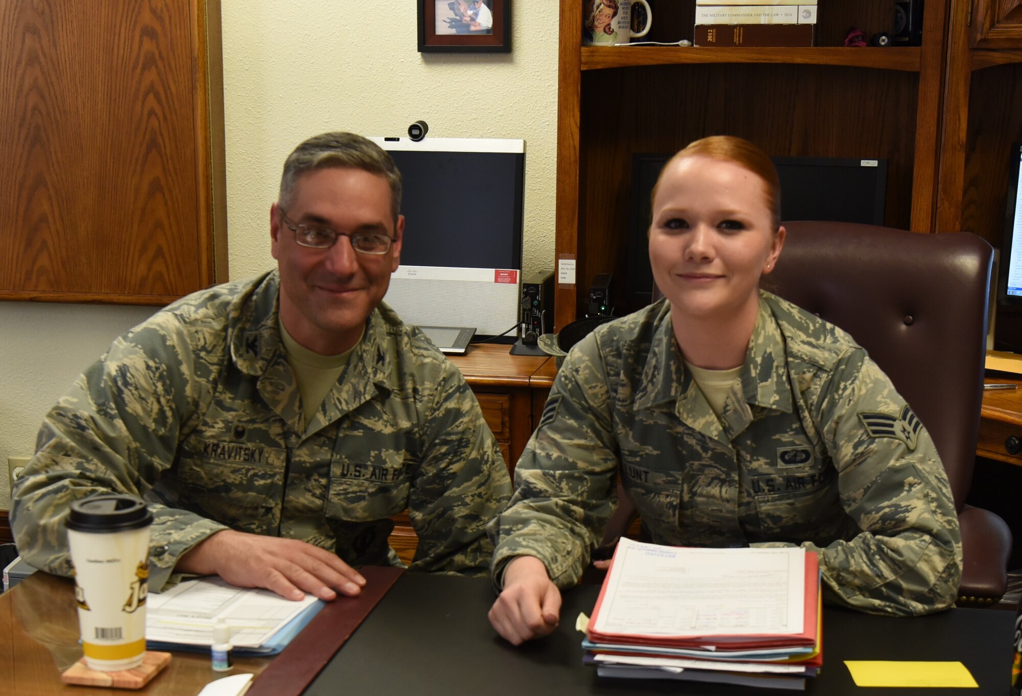 Col. Stephen Kravitsky, 90th Missile Wing commander and Senior Airman Cheryl Lunt, 90th Comptroller Squadron financial analyst technician, pause for a photo after spending the day together at F.E. Warren Air Force Base, Wyo., March 8, 2017. The shadowing program allows junior Airmen to accompany the commander for a day to learn how senior leaders lead the wing, tackle issues and make critical decisions. (U.S. Air Force Photo by 1st Lt Esther Willett)