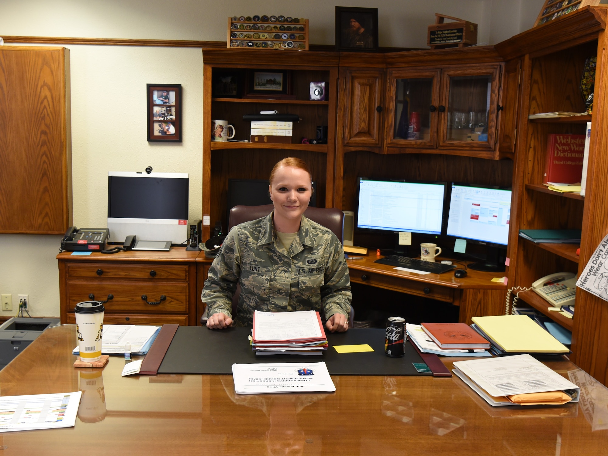 Senior Airman Cheryl Lunt, 90th Comptroller Squadron financial analyst technician, sits at the wing commander’s desk after shadowing Col. Stephen Kravitsky, 90th Missile Wing commander, for the day at F.E. Warren Air Force Base, Wyo., March 8, 2017. The shadowing program allows junior Airmen to accompany the commander for a day to learn how senior leaders lead the wing, tackle issues and make critical decisions. (U.S. Air Force Photo by 1st Lt Esther Willett)