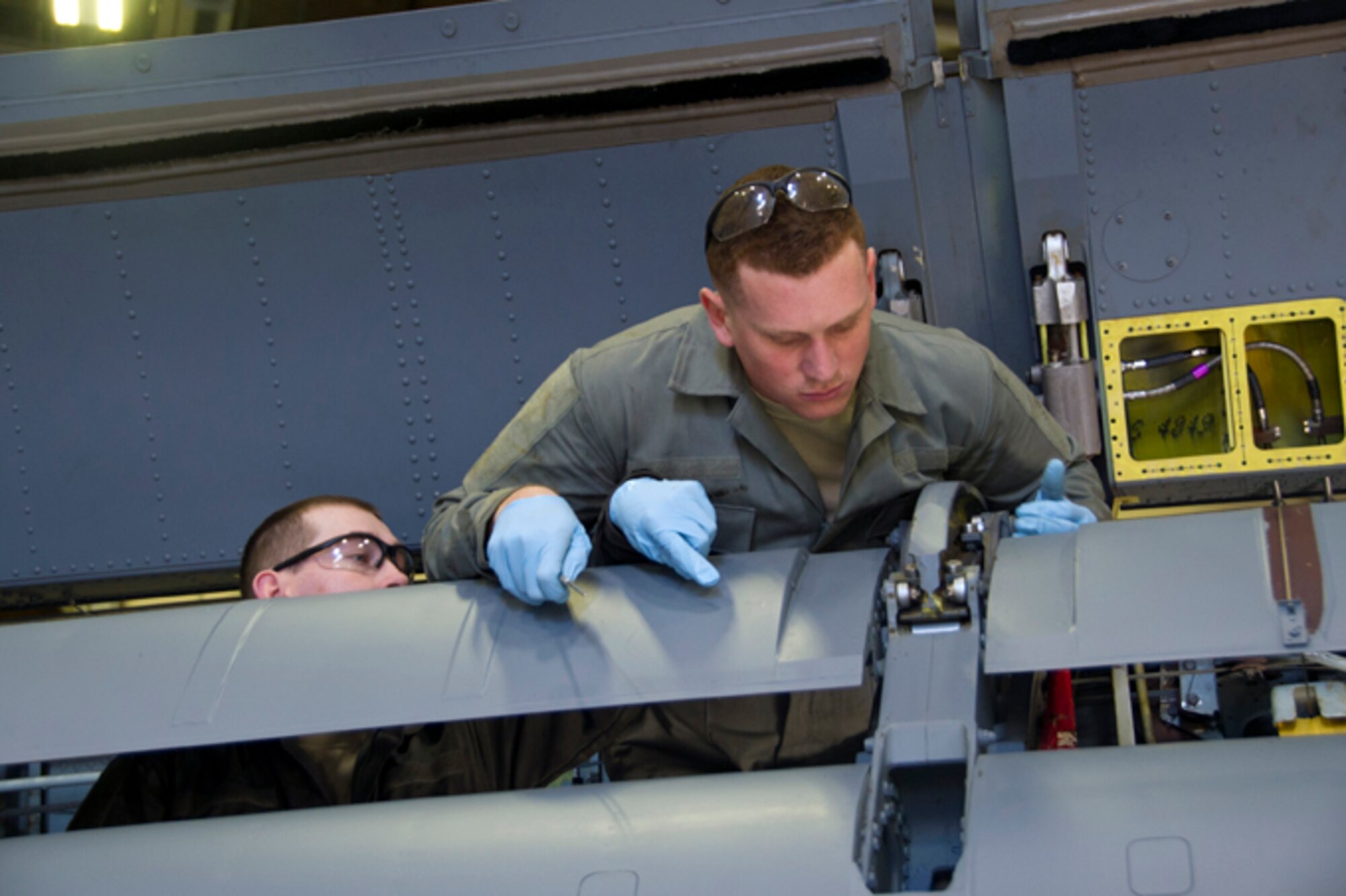 Staff Sgt. Sean Heart, 434th Maintenance Squadron aircraft mechanic, and Senior Airman Joseph Trimmer, 434th MXS aircraft mechanic, tighten screws on the wing of a KC-135R Stratotanker at Grissom Air Reserve Base, Ind., March 5, 2017. The maintenance was part of an isochronal inspection, in which every system on the aircraft is inspected for damage and signs of wear once every two years. (U.S. Air Force photo/Senior Airman Harrison Withrow)