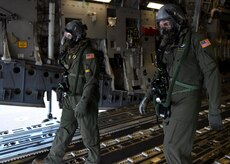 Staff Sgt. Jason Conner, left, 16th Airlift Squadron loadmaster, and Staff Sgt. Javier Lopez exit a C-17 Globemaster III during Exercise Bonny Jack 2017 on the flightline here, March 8, 2017. Exercise Bonny Jack 2017 is a three-part readiness exercise for the 437th Airlift Wing. The first major event in the exercise was a two-day mobility exercise March 1 and 2, followed by a CBRN exercise. Bonny Jack 2017 will conclude with a large-formation exercise in May.