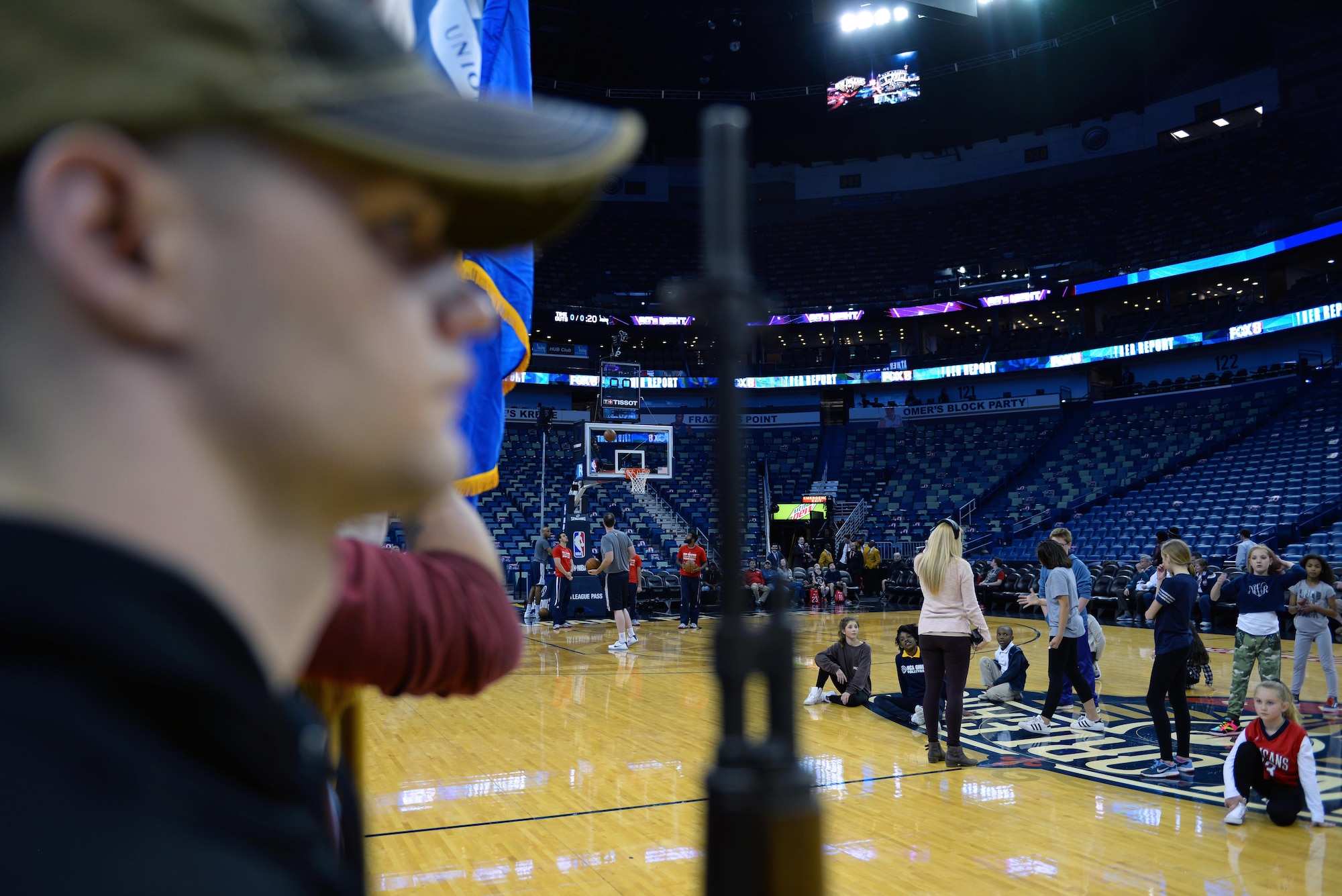 Members of the New Orleans Pelicans, a local dance troupe and the Keesler Honor Guard practice their respective routines during pregame warmups before a New Orleans Pelicans NBA game at the Smoothie King Center, March 3, 2017, in New Orleans. The Keesler Honor Guard posted the colors prior to the game. The Keesler Honor Guard performs hundreds of ceremonial details across Louisiana and Mississippi each year, including funerals, ceremonies, sporting events and parades. (U.S. Air Force photo by Senior Airman Duncan McElroy)