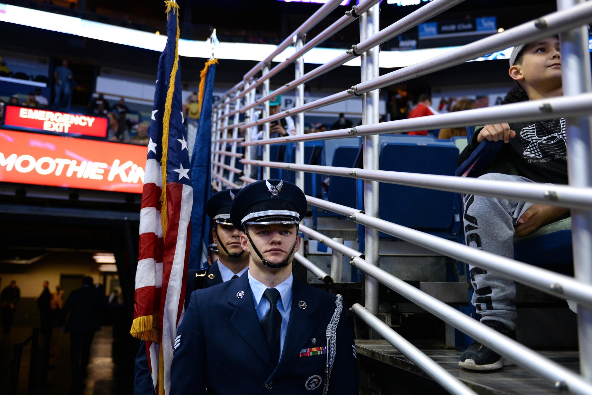 Senior Airman Terry Durbin, Keesler Honor Guard member, waits to march onto the court at a New Orleans Pelicans NBA game at the Smoothie King Center, March 3, 2017, in New Orleans. The Keesler Honor Guard posted the colors prior to the game. The Keesler Honor Guard performs hundreds of ceremonial details across Louisiana and Mississippi each year, including funerals, ceremonies, sporting events and parades. (U.S. Air Force photo by Senior Airman Duncan McElroy)