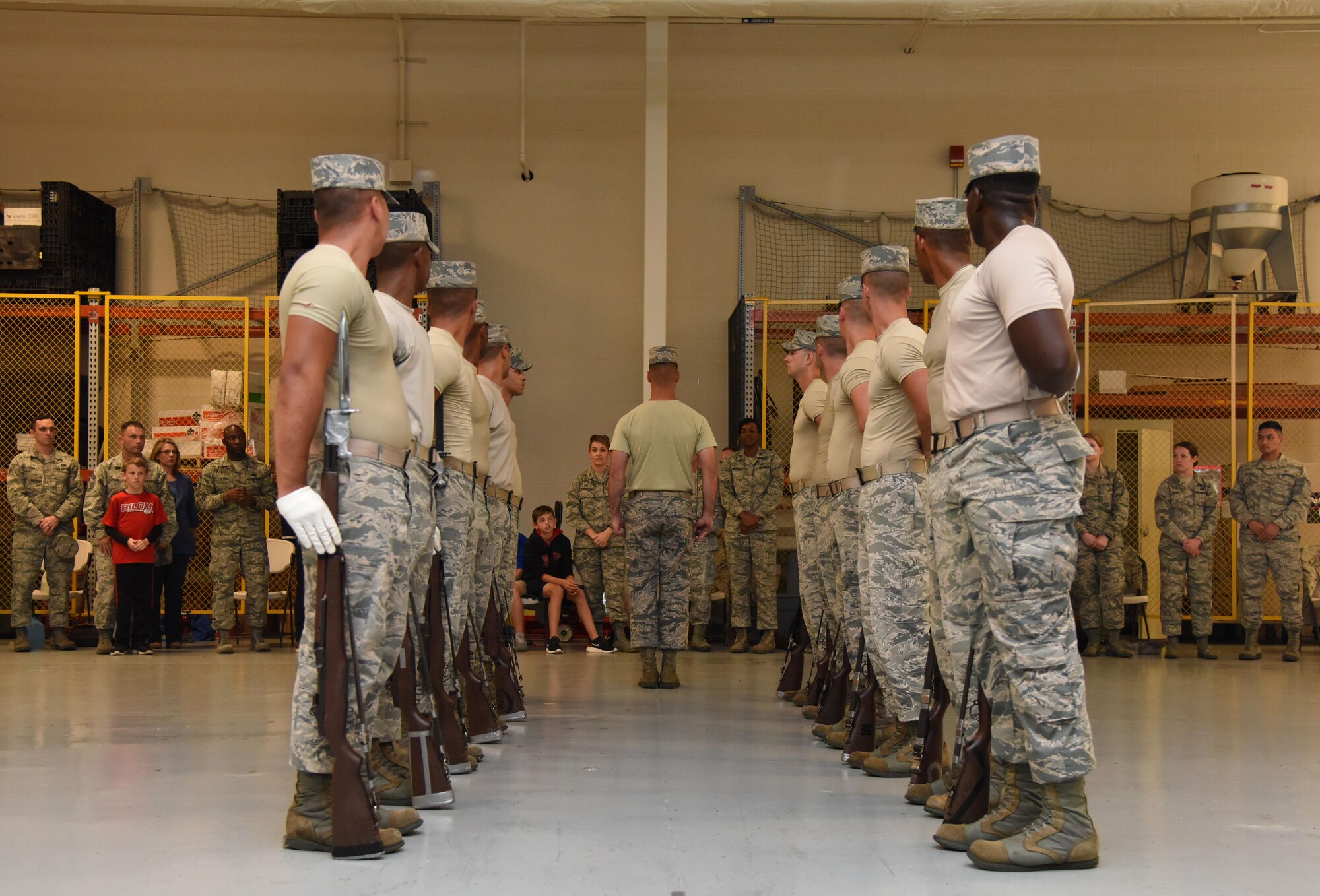 The U.S. Air Force Honor Guard Drill Team performs their new routine for base leadership at the Roberts Consolidated Aircraft Maintenance Facility March 2, 2017, on Keesler Air Force Base, Miss The team developed a new routine at Keesler during the past five weeks that they will use throughout the year. The team will unveil the routine at the 81st Training Group drill down competition March 10 2017. (U.S. Air Force photo by Kemberly Groue)