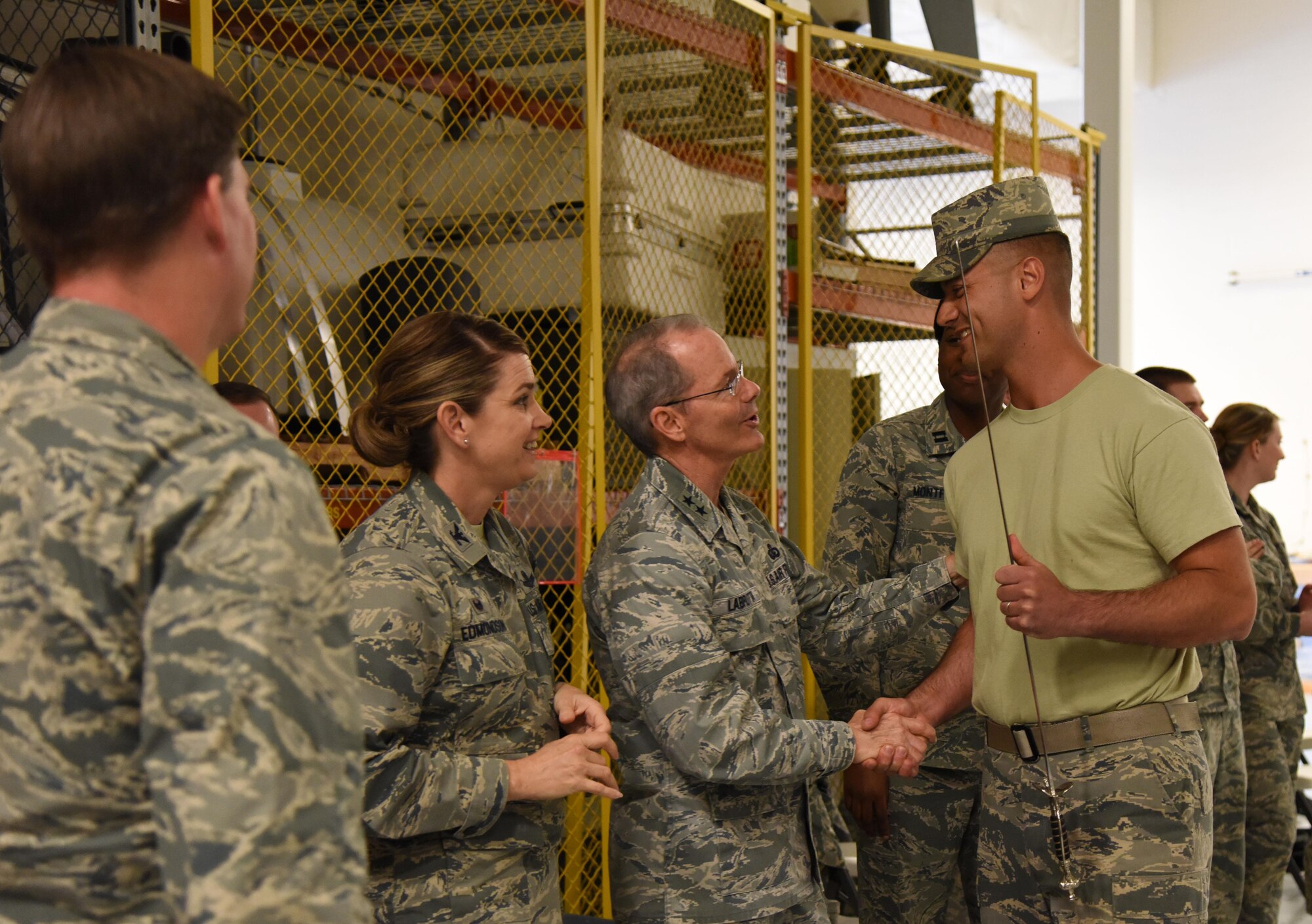 Maj. Gen. Bob LaBrutta, 2nd Air Force commander, greets Master Sgt. Jason Evans, U.S. Air Force Honor Guard Drill Team member, following a performance of the team’s new routine for base leadership at the Roberts Consolidated Aircraft Maintenance Facility March 2, 2017, on Keesler Air Force Base, Miss. The team developed a new routine at Keesler during the past five weeks that they will use throughout the year. The team will unveil the routine at the 81st Training Group drill down competition March 10 2017. (U.S. Air Force photo by Kemberly Groue)
