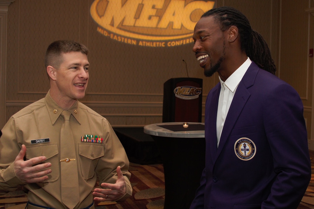 Major Joshua Darby speaks to Rashean Mathis before his induction into the MEAC Hall of Fame in Norfolk, Va., March 9, 2017. Mathis was a standout player at Bethune-Cookman University before his 12-year career in the NFL. The MEAC partnership provides the United States Marine Corps with an opportunity to celebrate the hard work, courage, and commitment to excellence exhibited by its many participants. Darby currently serves as the marketing public affairs officer at 4th Marine Corps District.