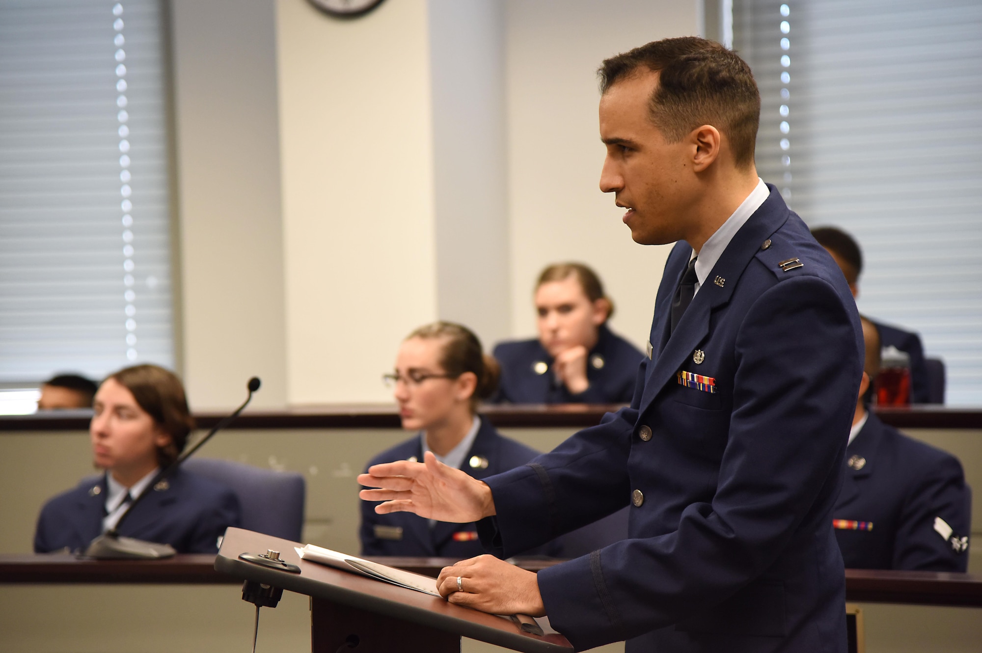 Capt. Victor Regal, Air Force Legal Operations Agency area defense counsel, questions the “accused” during a mock sexual assault trial held by the 81st Training Wing Legal Office at the Sablich Center March 3, 2017, on Keesler Air Force Base, Miss. The more than 30 Airmen, who served as jurors during the mock trial, were able to learn about military justice system. (U.S. Air Force photo by Kemberly Groue)