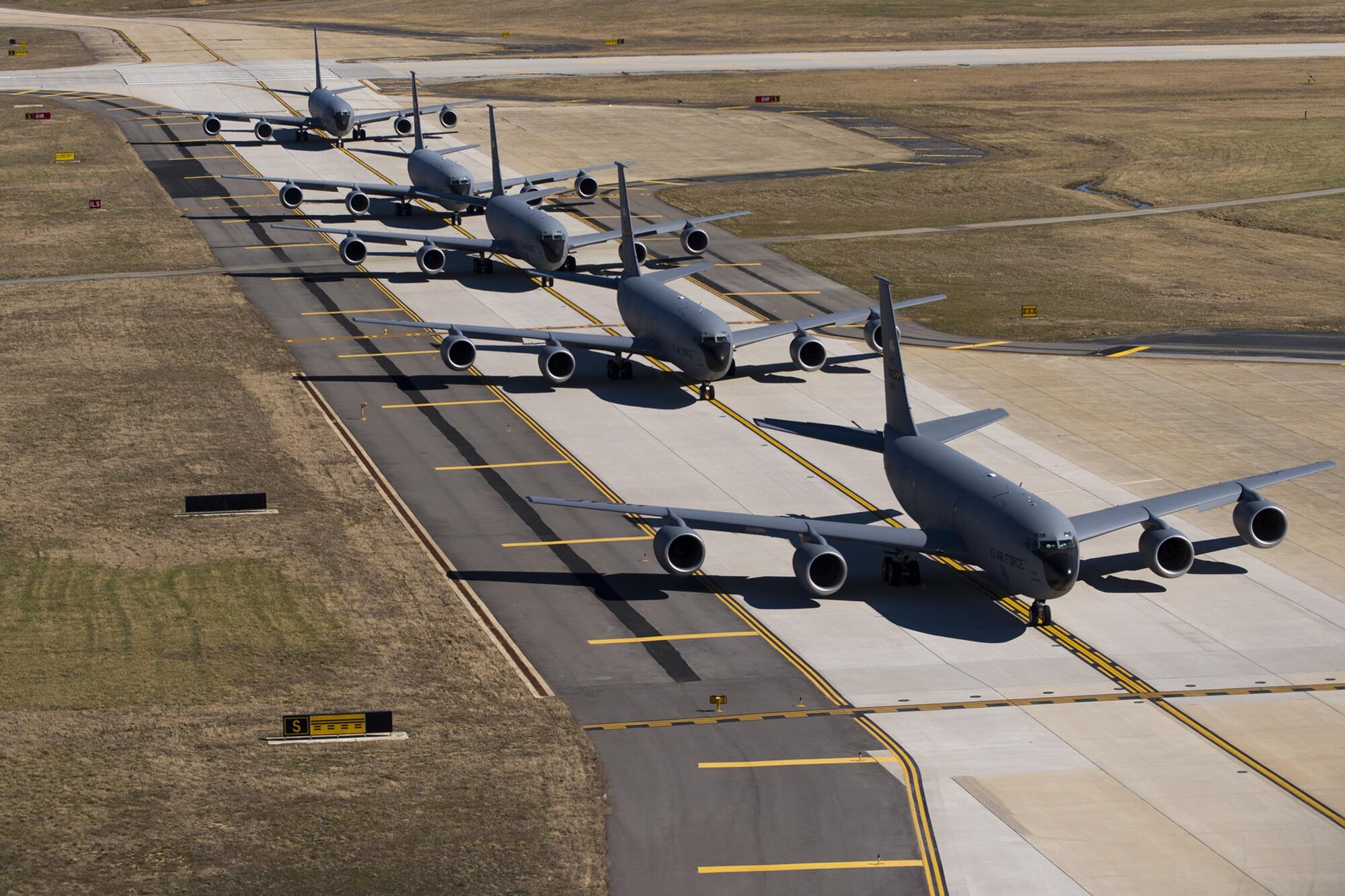 Five 459th Air Refueling Wing KC-135R Stratotankers conduct an elephant walk during an alert exercise at Joint Base Andrews, Maryland, March 5, 2017. The term “elephant walk” has been used since World War II when large numbers of aircraft would line up for rapid response take-off. Onlookers said the procession looked like elephants headed to a watering hole, and name has been part of the U.S. Air Force lexicon ever since. (U.S. Air Force photo/Tech. Sgt. Kat Justen)