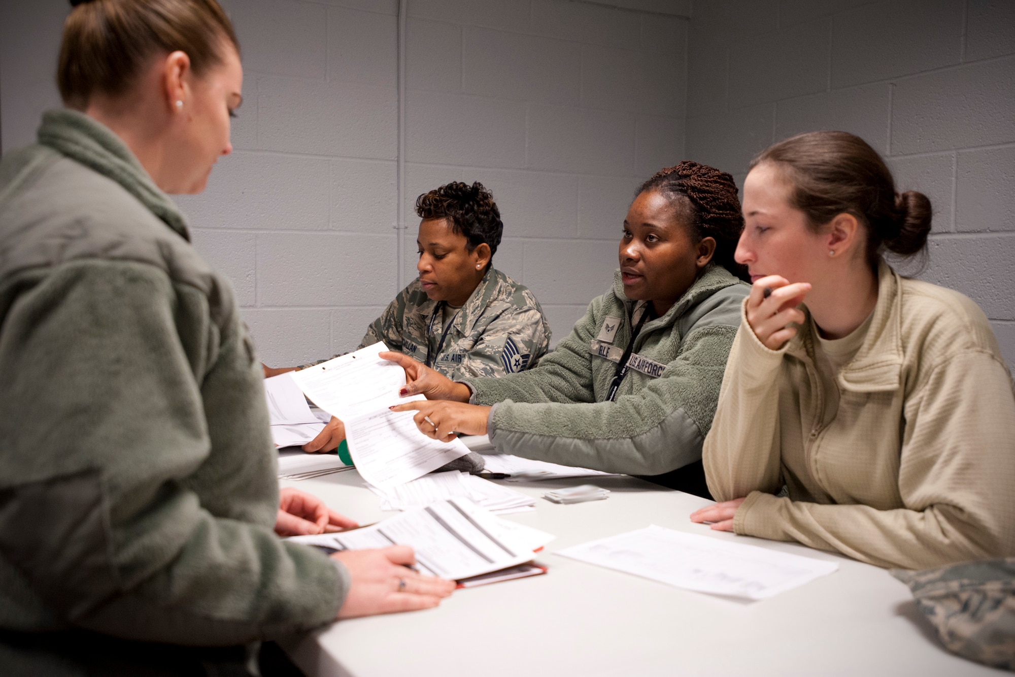 A 459th Air Refueling Wing member cycles through a simulated deployment line as part of an exercise at Joint Base Andrews, Maryland, March 5, 2017. Deployers prepared their mobility paperwork and bags prior to visiting Eligibility, Finance, Airman and Family Readiness, Chaplaincy, Legal, Medical and Passenger Manifest stations. (U.S. Air Force photo/Tech. Sgt. Kat Justen)