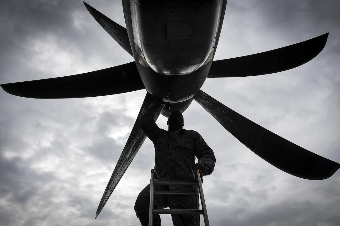 Air Force Tech. Sgt. Rainier Howard performs a preflight inspection of a C-130J Super Hercules at Kadena Air Base, Japan, March 6, 2017. The aircraft is the first of its kind to be assigned to Pacific Air Forces. Howard is a crew chief assigned to the 374th Aircraft Maintenance Squadron. Air Force photo by Staff Sgt. Michael Smith