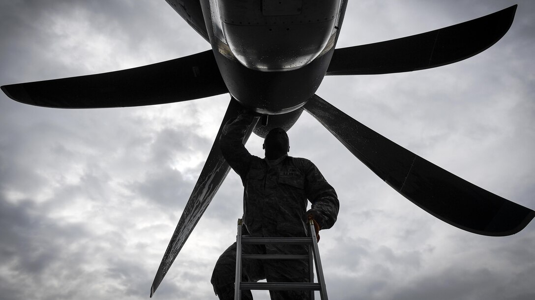 Air Force Tech. Sgt. Rainier Howard performs a preflight inspection of a C-130J Super Hercules at Kadena Air Base, Japan, March 6, 2017. The aircraft is the first of its kind to be assigned to Pacific Air Forces. Howard is a crew chief assigned to the 374th Aircraft Maintenance Squadron. Air Force photo by Staff Sgt. Michael Smith