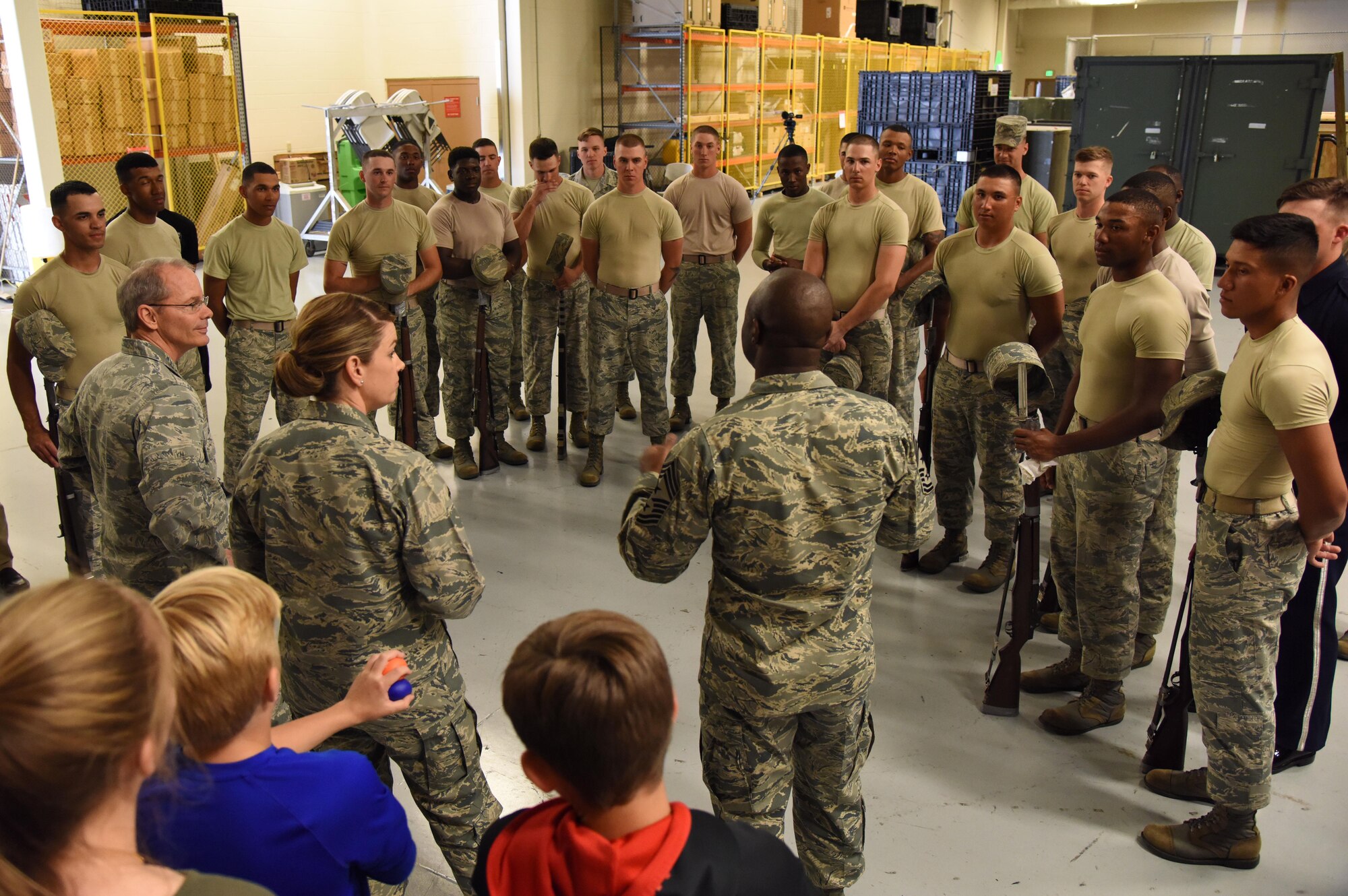 Chief Master Sgt. Vegas Clark, 81st Training Wing command chief, delivers remarks to U.S. Air Force Honor Guard Drill Team members following a performance of their new routine for base leadership at the Roberts Consolidated Aircraft Maintenance Facility March 2, 2017, on Keesler Air Force Base, Miss. The team developed a new routine at Keesler during the past five weeks that they will use throughout the year. The team will unveil the routine at the 81st Training Group drill down competition March 10 2017. (U.S. Air Force photo by Kemberly Groue)
