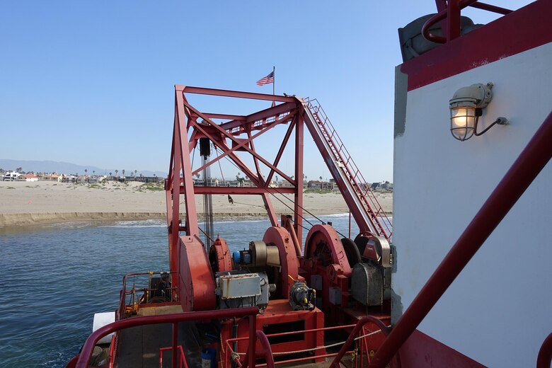 The hydraulic cutter-head suction dredge H.R. Morris digs up sediment from the Channel Islands Harbor sand trap Feb. 14. Seattle-based Manson Construction, the Corps' contractor for the project, piped the material to nearby Hueneme Beach to replenish sand lost to erosion.
