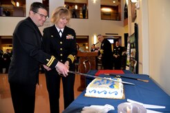 Naval Health Clinic Charleston Commanding Officer Capt. Elizabeth Maley, right, and Lt. Ryan Connolly, a physician at NHCC, cut the cake during a celebration in honor of the Navy Medical Corps' 146th birthday March 3 at NHCC. 
