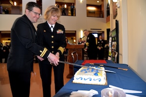 Naval Health Clinic Charleston Commanding Officer Capt. Elizabeth Maley, right, and Lt. Ryan Connolly, a physician at NHCC, cut the cake during a celebration in honor of the Navy Medical Corps' 146th birthday March 3 at NHCC. 
