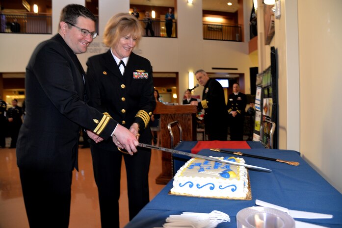 Naval Health Clinic Charleston Commanding Officer Capt. Elizabeth Maley, right, and Lt. Ryan Connolly, a physician at NHCC, cut the cake during a celebration in honor of the Navy Medical Corps' 146th birthday March 3 at NHCC. 

