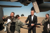 From left, U.S. Air Force Col. William Robertson, the commander of the 182nd Airlift Wing, Illinois Air National Guard; Gov. Bruce Rauner, the governor of the state of Illinois; and Chief Master Sgt. Patrick Armstrong, the 182nd Airlift Wing command chief, welcome Airmen home from a deployment in Peoria, Ill., March 7, 2017. More than 100 Airmen with the wing mobilized to an undisclosed location in Southwest Asia in support of Operation Freedom’s Sentinel. (U.S. Air National Guard photo by Tech. Sgt. Lealan Buehrer)