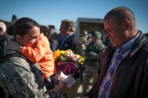 U.S. Air Force Tech. Sgt. Kimberly Cole, a mobility air forces electronic warfare systems specialist with the 182nd Maintenance Squadron, Illinois Air National Guard, reunites with family after returning home from deployment in Peoria, Ill., March 7, 2017. Cole and more than 100 Airmen with the 182nd Airlift Wing mobilized to an undisclosed location in Southwest Asia in support of Operation Freedom’s Sentinel. (U.S. Air National Guard photo by Tech. Sgt. Lealan Buehrer)