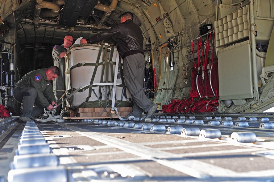 U.S. Air Force Airmen assigned to the 317th Operations Support Squadron rig cargo and perform a job inspection before takeoff at Dyess Air Force Base, Texas, March 8, 2017. The flight and airdrop were a part of the 317th Airlift Group Rodeo competition, in which pilots and loadmasters are graded on their ability to execute their skillsets both accurately and expeditiously. (U.S. Air Force photo by Airman 1st Class April Lancto)