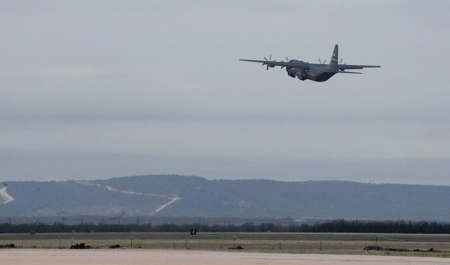 A U.S. Air Force C-130J Super Hercules takes off after loading and unloading a convoy vehicle at Dyess Air Force Base, Texas, March 8, 2017. The 317th Airlift Group Rodeo competition occurred over several hours and included the preparing and executing a series of tactical events such as cargo loading, ground and flying operations. (U.S. Air Force photo by Airman 1st Class April Lancto)