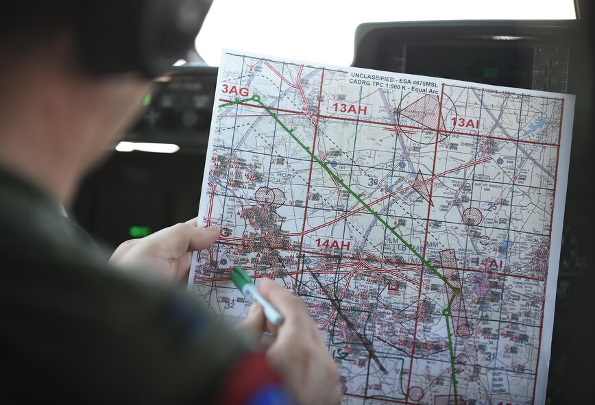 U.S. Air Force Capt. Jeff Schmidt, 39th Airlift Squadron pilot, reviews an aerial map with coordinates of an airdrop location over Bronte, Texas, March 8, 2017. One of the ten events that make up the 317th Airlift Group Rodeo competition was an airdrop which judged both pilots and loadmasters on their ability to successfully navigate a bundle to a precise location in a drop zone. (U.S. Air Force photo by Airman 1st Class Emily Copeland)  
